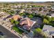 Great aerial perspective of home showcasing community, pool, and desert landscaping at 4637 W Misty Willow Ln, Glendale, AZ 85310