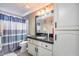 Bathroom features a vanity with a granite countertop and a shower with a curtain at 4637 W Misty Willow Ln, Glendale, AZ 85310