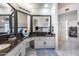 Bathroom featuring dual sinks with granite counters, cabinets, and decor at 4637 W Misty Willow Ln, Glendale, AZ 85310