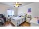 Cozy bedroom with a ceiling fan and ample natural light at 4637 W Misty Willow Ln, Glendale, AZ 85310