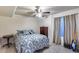 Comfortable bedroom features a bed, a window, and a bedside table at 4637 W Misty Willow Ln, Glendale, AZ 85310
