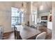 Spacious dining area featuring a chandelier and views of the entry and living room at 4637 W Misty Willow Ln, Glendale, AZ 85310