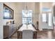 Elegant dining room features a chandelier, hardwood floors, and a large window view at 4637 W Misty Willow Ln, Glendale, AZ 85310