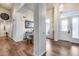 Open-concept foyer with hardwood floors, chandelier, and views of dining and living spaces at 4637 W Misty Willow Ln, Glendale, AZ 85310