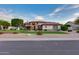 Charming single-story home featuring a brick-accented facade, well-manicured lawn, and mature landscaping at 4637 W Misty Willow Ln, Glendale, AZ 85310