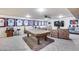 Spacious game room features a pool table, comfortable seating, and display shelves at 4637 W Misty Willow Ln, Glendale, AZ 85310
