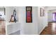 Stylish hallway with wood flooring and interesting art at 4637 W Misty Willow Ln, Glendale, AZ 85310