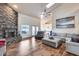 Spacious living room boasts high ceilings, a brick fireplace, and an open floor plan at 4637 W Misty Willow Ln, Glendale, AZ 85310