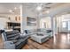 Open-concept living area featuring wood floors and easy access to the kitchen and dining area at 4637 W Misty Willow Ln, Glendale, AZ 85310