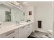 Modern bathroom featuring a large mirror, white countertops, sleek drawers, and modern fixtures at 4808 N 24Th St # 1003, Phoenix, AZ 85016