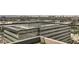 Rooftop view of modern building with clear barriers and a beautiful city skyline at 4808 N 24Th St # 1003, Phoenix, AZ 85016