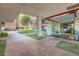 Inviting entrance to building with a lush courtyard, brick walkway, and glass entryway at 4808 N 24Th St # 1003, Phoenix, AZ 85016