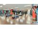 A spacious gym featuring multiple treadmills and exercise equipment with views of the city from large windows at 4808 N 24Th St # 1003, Phoenix, AZ 85016
