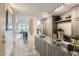 Stylish kitchen with gray cabinets, marble floors, stainless steel appliances, and lots of natural light at 4808 N 24Th St # 1003, Phoenix, AZ 85016