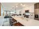 Contemporary kitchen with white cabinets, marble floors, stainless steel appliances, and city views at 4808 N 24Th St # 1003, Phoenix, AZ 85016
