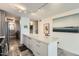 Modern kitchen with white cabinets, island, stainless steel appliances, and marble floors at 4808 N 24Th St # 1003, Phoenix, AZ 85016
