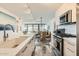 Sleek kitchen with white cabinets, stainless appliances, marble floors, and bright natural light at 4808 N 24Th St # 1003, Phoenix, AZ 85016