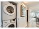 Convenient laundry area with stacked washer and dryer set and neutral-toned hallway at 4808 N 24Th St # 1003, Phoenix, AZ 85016
