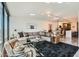 Open-concept living room flows into the kitchen, featuring large windows and modern decor at 4808 N 24Th St # 1003, Phoenix, AZ 85016