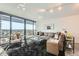 Spacious living room with city views, stylish decor, and comfortable seating at 4808 N 24Th St # 1003, Phoenix, AZ 85016