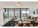 Bright living room boasts expansive windows, comfortable seating, and city views at 4808 N 24Th St # 1003, Phoenix, AZ 85016