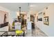 Open-concept with kitchen island, dining area, modern lighting, and lots of art on display at 4808 N 24Th St # 1003, Phoenix, AZ 85016