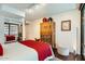 Comfortable main bedroom featuring hardwood floors, area rug, and stylish furniture and decor at 4808 N 24Th St # 1003, Phoenix, AZ 85016