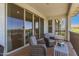 Enjoy the outdoor views from this private covered balcony featuring dual chairs and sliding glass door at 5100 E Rancho Paloma Dr # 2065, Cave Creek, AZ 85331