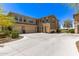 Inviting home featuring a large concrete driveway and a three-car garage, perfect for Gathering and guests at 5100 E Rancho Paloma Dr # 2065, Cave Creek, AZ 85331