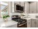Modern kitchen showcasing stainless steel appliances, ample countertop space, and decorative plants at 5100 E Rancho Paloma Dr # 2065, Cave Creek, AZ 85331
