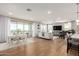 Spacious open-concept living area featuring hardwood floors, modern decor, and a dining area at 5100 E Rancho Paloma Dr # 2065, Cave Creek, AZ 85331
