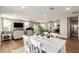 Open floor plan showcasing a bright living room seamlessly connected to the kitchen and dining area at 5100 E Rancho Paloma Dr # 2065, Cave Creek, AZ 85331
