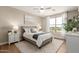 Bright bedroom with a plush bed, elegant lighting, and a large window offering scenic views at 5100 E Rancho Paloma Dr # 2065, Cave Creek, AZ 85331