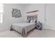 Quaint bedroom with aviation decor, and a unique headboard at 5228 S 106Th Pl, Mesa, AZ 85212