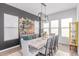 Chic dining room with a long table, seating, custom bar area, and ample natural light at 5228 S 106Th Pl, Mesa, AZ 85212