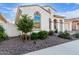 Charming home exterior boasts desert landscaping, an arched window, and a well-maintained front yard at 5228 S 106Th Pl, Mesa, AZ 85212