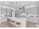 Bright kitchen featuring stainless steel appliances, ample cabinet space, and a large center island at 5228 S 106Th Pl, Mesa, AZ 85212