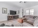 Comfortable living room boasts a sectional sofa, stylish decor, and a neutral color palette at 5228 S 106Th Pl, Mesa, AZ 85212
