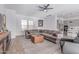 Spacious living room features a sectional sofa, modern decor, and hardwood floors at 5228 S 106Th Pl, Mesa, AZ 85212