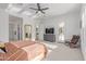 Spacious primary bedroom with an ensuite bathroom, walk-in closet, and outdoor access at 5228 S 106Th Pl, Mesa, AZ 85212