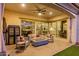 Comfortable covered patio with stylish furniture, fire pit, and a view of the interior rooms at 5228 S 106Th Pl, Mesa, AZ 85212