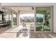 Inviting covered patio with comfortable seating and views of the manicured backyard and open-concept living space at 5228 S 106Th Pl, Mesa, AZ 85212