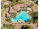 Aerial view of the resort-style pool, multiple lounge areas, and lush landscaping at 5450 E Deer Valley Dr # 1195, Phoenix, AZ 85054