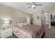Inviting bedroom with a comfortable bed, decorative pillows, and an en-suite bathroom with walk-in shower at 5450 E Deer Valley Dr # 1195, Phoenix, AZ 85054