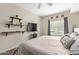 Bedroom featuring a plush bed, floating shelves, and large window, creating a serene and inviting atmosphere at 5450 E Deer Valley Dr # 1195, Phoenix, AZ 85054