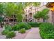 Beautiful building exterior with lush landscaping and a cozy outdoor seating area at 5450 E Deer Valley Dr # 1195, Phoenix, AZ 85054