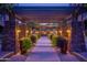 Elegant covered walkway featuring stone pillars, lush plants, and decorative lighting at 5450 E Deer Valley Dr # 1195, Phoenix, AZ 85054