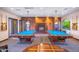 Game room with two pool tables, a fireplace, and modern lighting at 5450 E Deer Valley Dr # 1195, Phoenix, AZ 85054