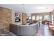 Open lounge with sectional sofa, fireplace, and wall-mounted television at 5450 E Deer Valley Dr # 1195, Phoenix, AZ 85054