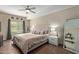 Relaxing main bedroom featuring a plush bed, side tables, and large windows, bathed in natural light at 5450 E Deer Valley Dr # 1195, Phoenix, AZ 85054